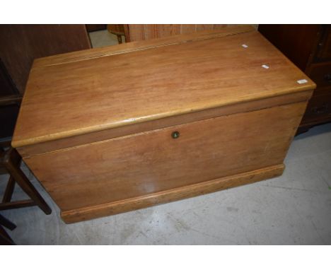 A large stripped vintage bedding box or chest having handles to sides.