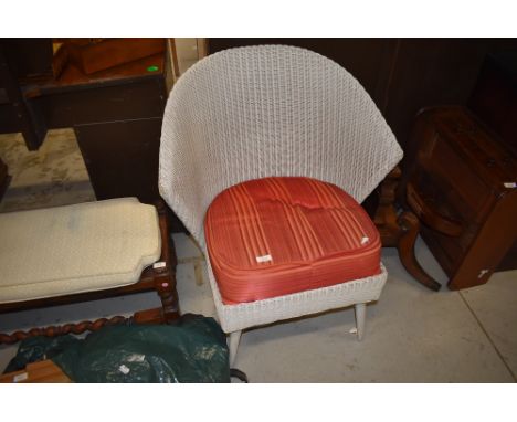 A vintage wicker Lloyd Loom style chair having fan shaped back.