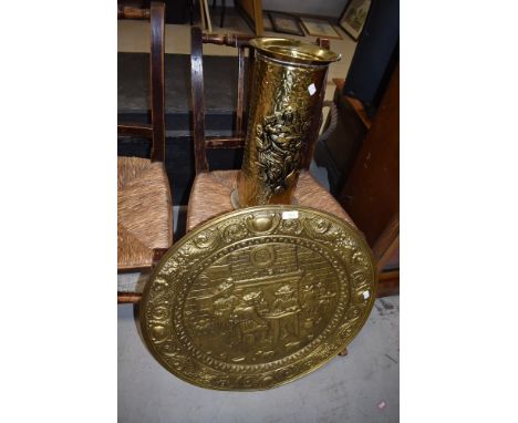 A brass stick stand and circular tray
