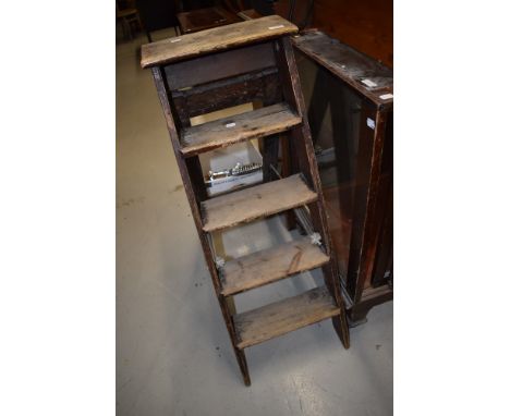 A set of vintage wooden step ladders