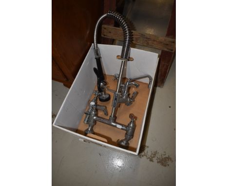 A vintage chrome mixer tap and a pair of classical York taps