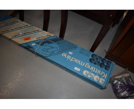 A vintage Bond knitting machine in original box