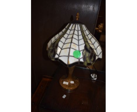 A Tiffany style desk or table lamp having Art Nouveau style base