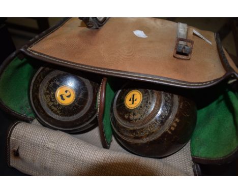 A set of four vintage Jaques lignum vitae bowls, Bias number 3, in bag