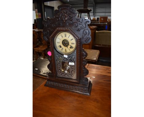 A Victorian stained frame American style mantel clock