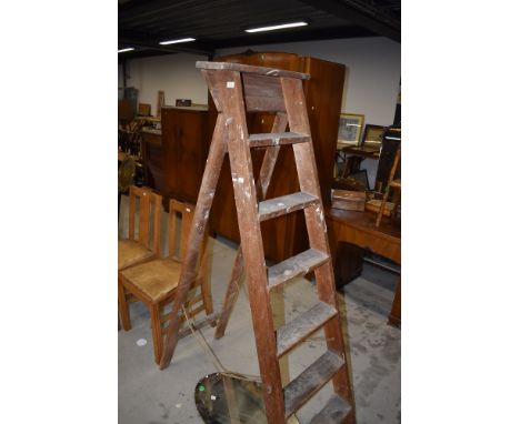 A set of vintage wooden stepladders
