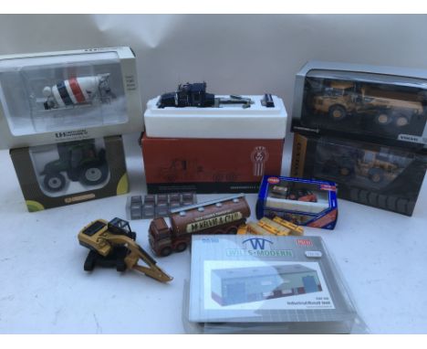 A collection of boxed and loose diecast vehicles including Tractor, fork lift, Earth movers etc