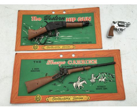 Marx toys, carded cap guns, The western hip gun and The Sharps Carbine, and one other