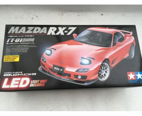 Tamiya models, Mazda RX-7, 1:10 scale RC 4WD, shaft driven 4WD chassis, assembly kit includes an electronic forward and rever