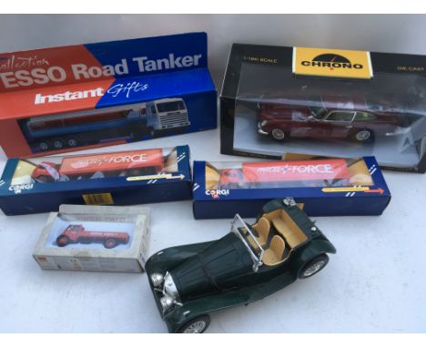 A collection of boxed Diecast vehicles including, Esso Road tanker, Chrono 1:18 scale Aston Martin DB5 and 2 Corgi parcel for