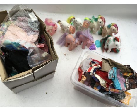 A box containing a collection of vintage Sindy , Barbie and Patch clothes and accessories, also includes a selection of Hasbr