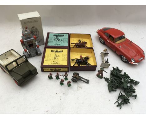 A box containing a 1:18 scale E-type jag, Britains figures on horseback boxed , a reproduction clockwork, tinplate robot, a T