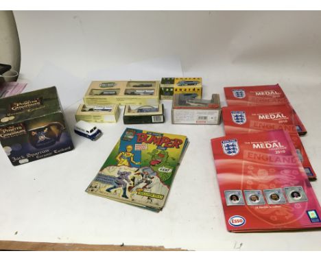 A box containing boxed diecast, Marvel Bumper comics , Esso medal football collections and a Pirates of the Caribbean, jack s