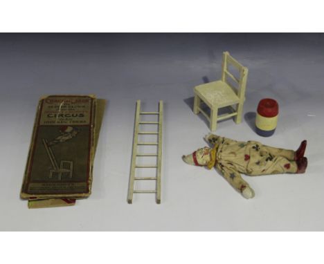 A Schoenhut's Cracker-Jack the Clever Clown from the Humpty Dumpty Circus, comprising clown, chair, ladder, barrel, instructi
