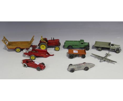 A small collection of Dinky Toys vehicles, including a No. 25d petrol tank wagon, a No. 25e tipping wagon, a No. 23b Hotchkis