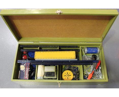 A collection of Meccano blue, yellow and plated parts, including girders, flat plates, cogs, chains, various tools and a No. 