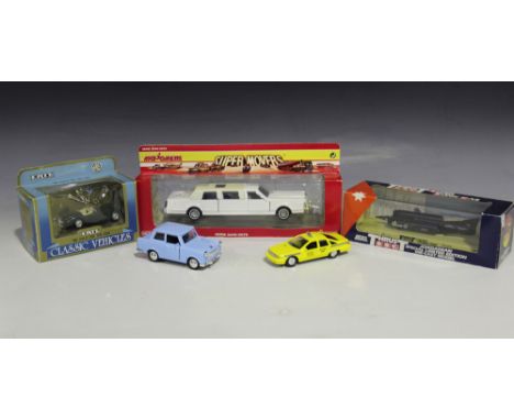 A collection of die-cast vehicles, including a Tri-ang Spot-On No. 265 Tonibell ice cream van, a Ford Zephyr Six, a Gama Mini