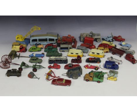 A collection of Dinky Toys vehicles, including a No. 40j Austin Somerset, a No. 453 Trojan van 'Oxo', a 25 Series petrol tank