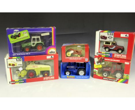 A collection of modern Britains and other tractors and combine harvesters, including a No. 9504 Fendt 615 tractor, a No. 9516
