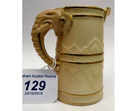 A Royal Worcester gilded blush ivory glazed cream jug with an elephant's head handle  bears a date cypher for 1902       OS2