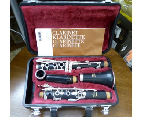 A Yamaha silver plated clarinet, in a fitted maroon fabric lined case       CA