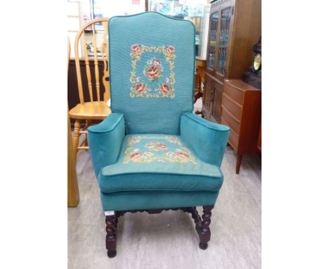 An early 20thC tapestry upholstered hall chair, raised on barleytwist supports and block forelegs       CA