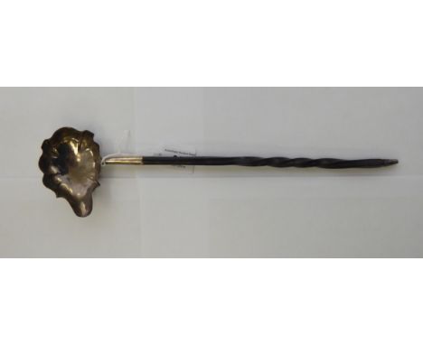 A 19thC silver toddy ladle, on a whalebone handle  indistinct London marks       11
