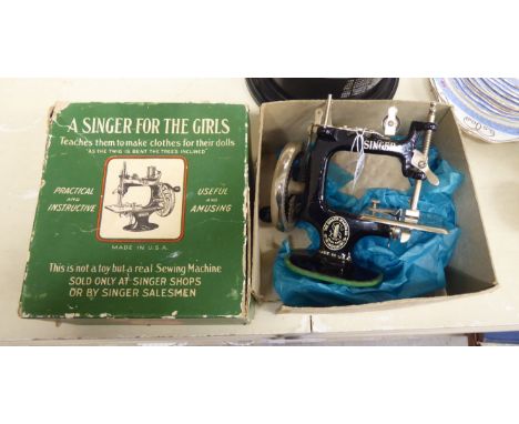 A 'vintage' child's Singer manual sewing machine  boxed       TOS8