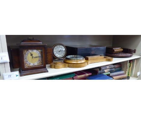 A mixed lot: to include an Oriental, exotic hardwood veneered writing box  5''h  14''w; and an aneroid barometer, on a carved
