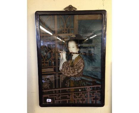 An early 20th century Chinese reverse glass painting: Chinese lady playing flute (in original frame).