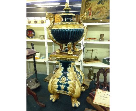 An early 20th century continental Art Pottery lidded pot and stand in the Burmantofts style (af).