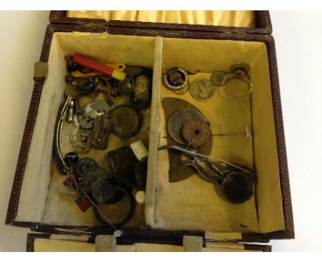 A box of collectables and badges including a Georgian silver and enamel Shilling.