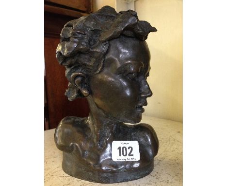 R Moll: A small limited edition bronzed bust: Young child with curly hair.