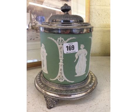 A 19th century pale green Wedgwood Jasper Ware biscuit barrel with plated mounts on plated stand, decorated with classical fe