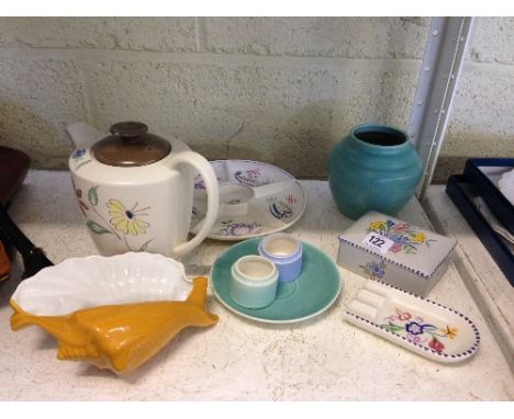 Nine various Poole Pottery items.
