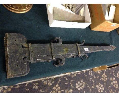 A set of four heavy cast iron gate brackets.