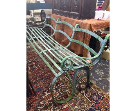 A heavy 19th century green painted wrought iron three seater cast iron park garden bench.