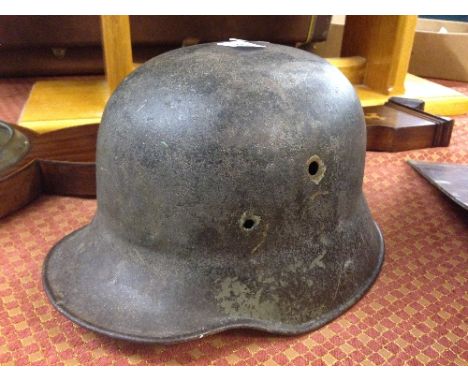 A WWI German helmet (possibly M16 or M18) (no lining).