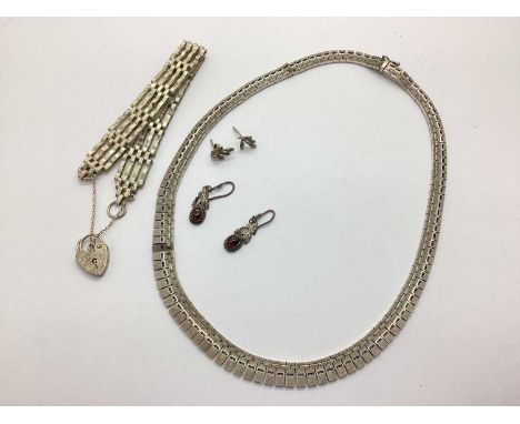 A Modern Collarette Style Necklace, comprising graduated panels of brushed finish with pierced decoration, to push clasp with