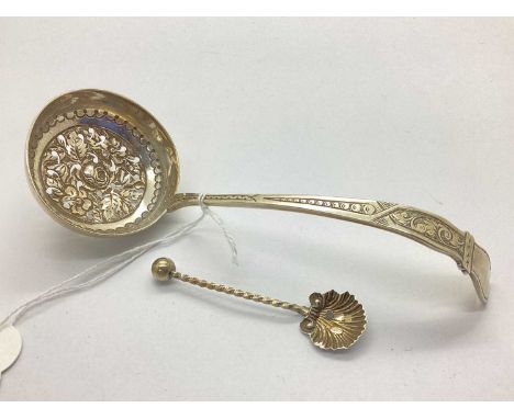A Victorian Hallmarked Silver Tea Strainer Spoon, T.H, 1887, of highly decorative design with pierced flowerhead and foliage 