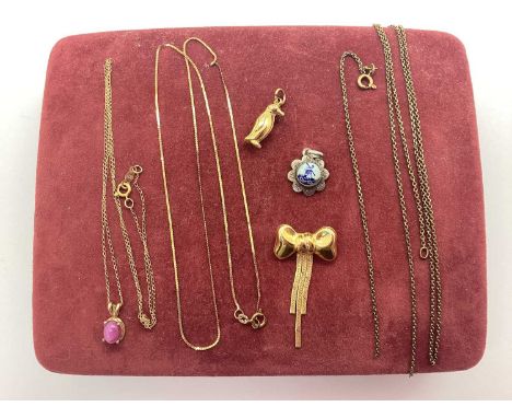 A 9ct Gold Bow Style Brooch, suspending flat tassles, a 9ct gold penguin charm, a fine chain, stamped "14k", suspending claw 
