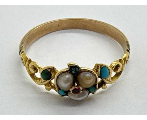 An Edwardian Style Freshwater Pearl and Stone Set Ring, of flowerhead design to centre, between pierced shoulders of scrollin