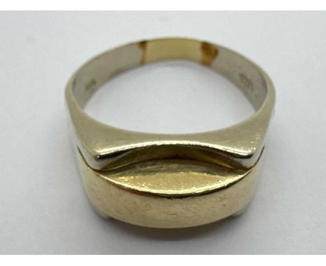 A Modernist Style Two-Tone Gent's Ring, the centre panel between wide tapered shoulders, stamped "585" (misshapen) (finger si