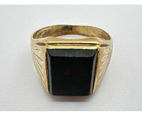 A 9ct Gold Hardstone Signet Style Ring, the rectangular hardstone inset between wide tapered shoulders (finger size T) (5gram