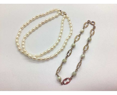 A Decorative Pearl Bracelet, of alternate openwork panel design stamped "9 375", together with a two row freshwater pearl bea