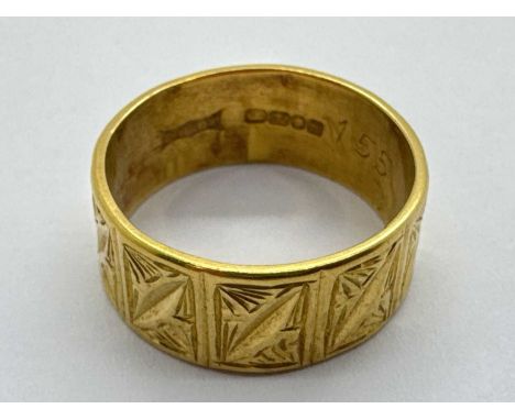 A 22ct Gold Wide Wedding Band, allover textured finish (finger size M).The ring weighs 6grams.