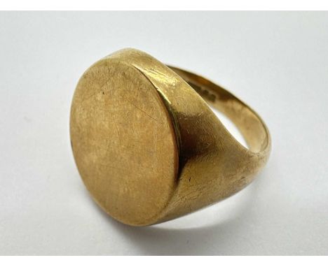 A 9ct Gold Gent's Signet Ring, the vacant oval panel between wide tapered shoulders (finger size U1/2) (7.5grams).The signet 