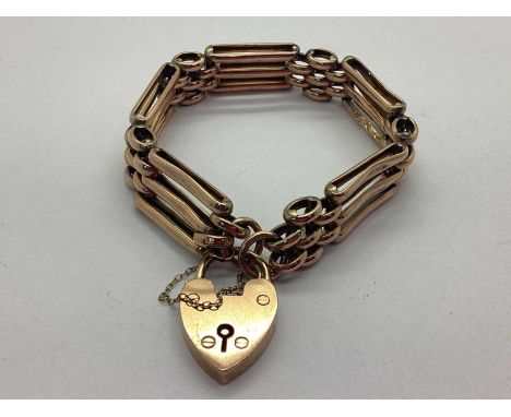 A Vintage Gate Link Bracelet, to heartshape padlock clasp and safety chain, stamped "9ct", 18cm long (15grams).