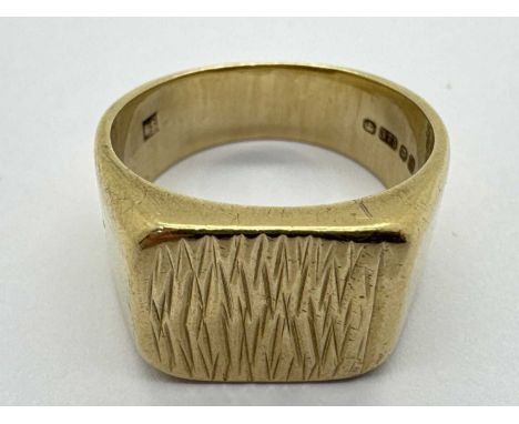 A 9ct Gold Chunky Gent's Signet Ring, the rectangular centre panel of bark textured finish, between wide tapered shoulders (f