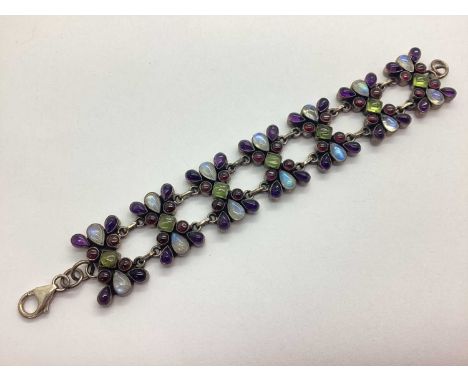 A Highly Decorative Gemstone Inset Panel Bracelet, the varied cut stones allover collet set between chain link connections, s